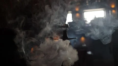 Visitor cafe Smoking a hookah Stock Footage 137490359