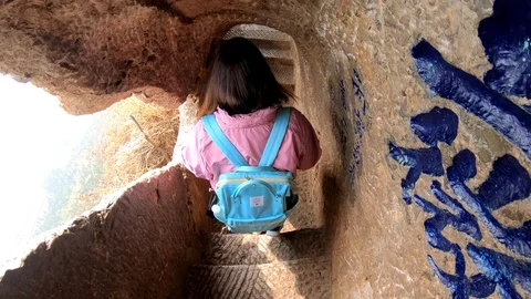 Visitor climb staircase at Dragon Gate on West Hill, Kunming  Stock Footage 104933979