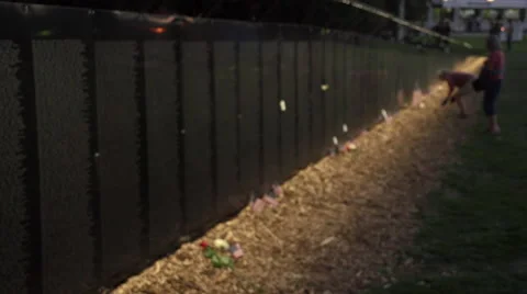Visitor fixes flag next to Vietnam Wall That Heals. Stock Footage 47392205
