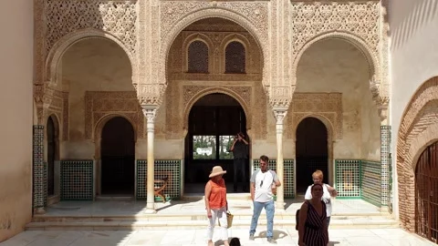 Visitor heads to gilded room, cuarto dorado, alhambra, granada Stock Footage 280852375