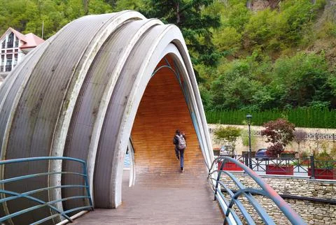 Visitor jumping onto the Inside Curve of Mobius Loop Bridge, Georgia Stock Photos