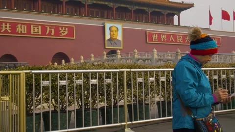 Visitor with Mobile Device in Front of Tiananmen Gate and Mao Zedong Portrait Stock Footage 345688456