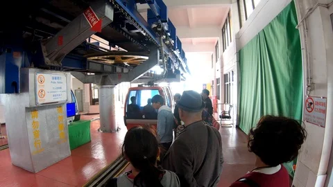 Visitor or tourist using cable car service to Dragon Gate, Kunming, China Stock Footage 104934527