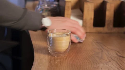 Visitor is paying for coffee and taking a cup of cappuccino close up. Customer Stock Footage 126853160