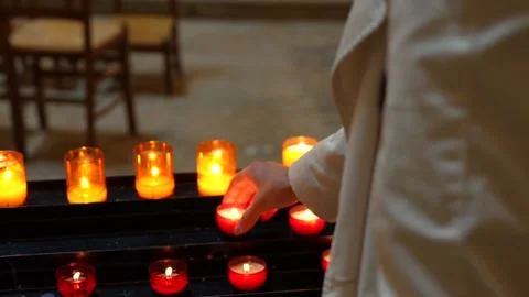 Visitor Placing Devotional Candle Among Votive Candles, Versailles Chapel Stock Footage 337053740