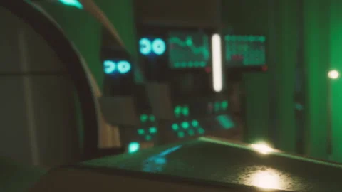 Visitor stands near high tech equipment in a futuristic lab at night Stock Footage 345054658