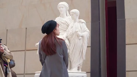 Visitor Viewing Cornelia Africana Marble Sculpture By Jules Cavelier At Musee d Stock Footage 339687281