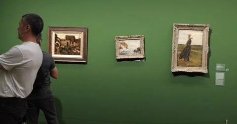 Visitor viewing three landscape paintings on green wall in Leopold Museum Video stock 321031921