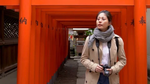 Visitor walking out of the Torii to leave Stock Footage 97047941