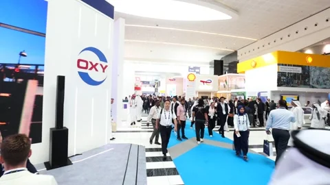 Visitors and atendees moving around ADIPEC 2025 Stock Footage 321045962