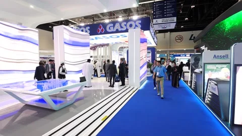 Visitors and atendees moving around ADIPEC 2025 Stock Footage 321046092