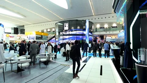 Visitors and atendees moving around ADIPEC 2025 Stock Footage 321046111
