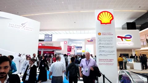Visitors and atendees moving around ADIPEC 2025 Stock Footage 321046596