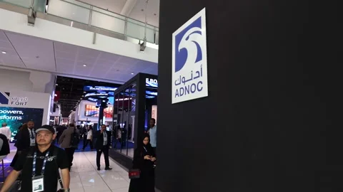Visitors and atendees moving around ADIPEC 2025 Stock Footage 321046600
