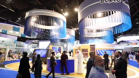 Visitors and atendees moving around ADIPEC 2025 Stock Footage 321046941