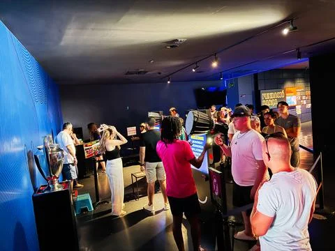 Visitors and crowd exploring interactive FC Barcelona museum exhibits in Ba.. Stock Photos