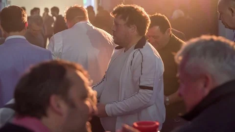 Visitors are hanging out, talking and enjoying food Stock Footage 84139092
