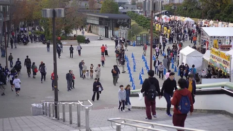 Visitors are seen coming to ramen festival at Osakojokoen Station Stock Footage 99861608