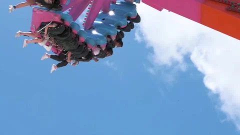 Visitors are seen riding at the Flash Thrill ride the amusement and animal Stock Footage 155957657