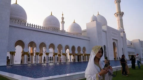 Visitors are seen touring the Sheikh Zayed Grand Mosque in Abu Dhabi Stock Footage 321462908