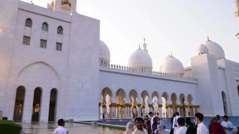 Visitors are seen touring the Sheikh Zayed Grand Mosque in Abu Dhabi 動画素材 321463046