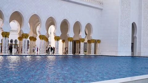 Visitors are seen touring the Sheikh Zayed Grand Mosque in Abu DhabI 動画素材 321463271