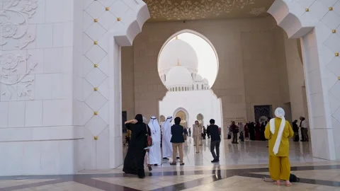 Visitors are seen touring the Sheikh Zayed Grand Mosque in Abu Dhabi Stock Footage 321463503