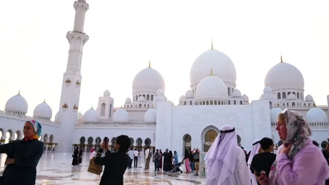 Visitors are seen touring the Sheikh Zayed Grand Mosque in Abu Dhabi Stock Footage 321463544
