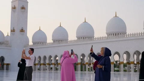 Visitors are seen touring the Sheikh Zayed Grand Mosque in Abu Dhabi Stock Footage 321463598