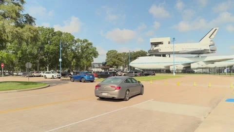 Visitors arrive at Space Center Houston, passing NASA 905 and shuttle replica Stock Footage 342245915