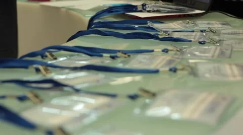 Visitors' badges on the table Stock Footage 56156684