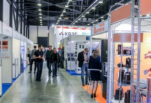 Visitors between the stands. Stock Photos