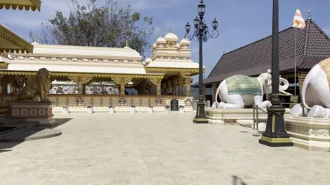 Visitors at Buddhist Temple Courtyard with Elephant Statue in Sri Lanka Video stock 331667131