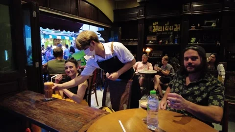 Visitors to the cafe in the evening in Phuket Town Stock Footage 208029797