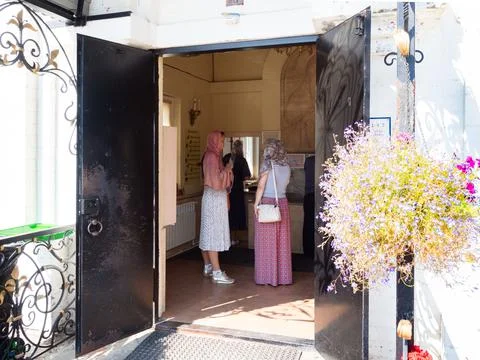 Visitors in chapel wait consecrated spring water Stock Photos