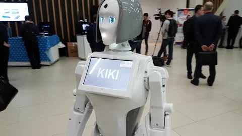 Visitors communicate with the robot Stock Footage