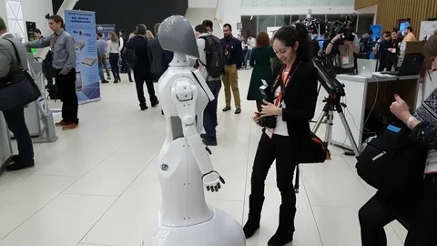Visitors communicate with the robot Stock Footage