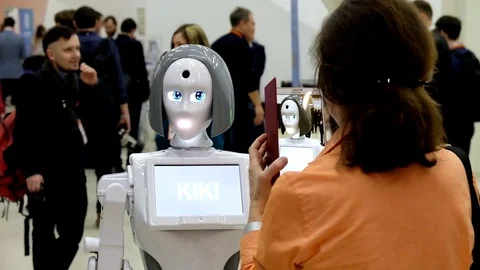 Visitors communicate with the robot Stock Footage