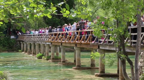 Visitors crossing bridge over river Krka Stock Footage 49905368