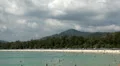 Visitors during the summer season, sun tanning and swimming near the beach HD Footage