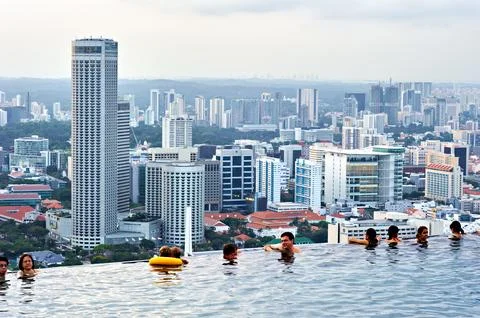 Visitors enjoy the Infinity Pool at Marina Bay Sands Stock Photos
