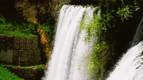 Visitors enjoy at view over big waterfall of Pliva river Stock Footage 140434756