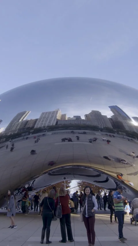 Visitors Enjoying Cloud Gate's Unique Reflection in Chicago Stock Footage 322568565