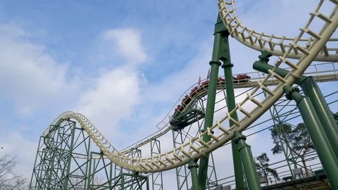 Visitors enjoying a ride in a rollercoaster. Stock Footage 126009250