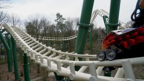 Visitors enjoying a ride in a rollercoaster. Stock Footage 126009265