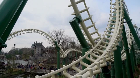 Visitors enjoying a ride in a rollercoaster. Stock Footage 126009268