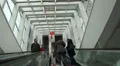Visitors on escalator at Light and Sound exhibition HD Footage