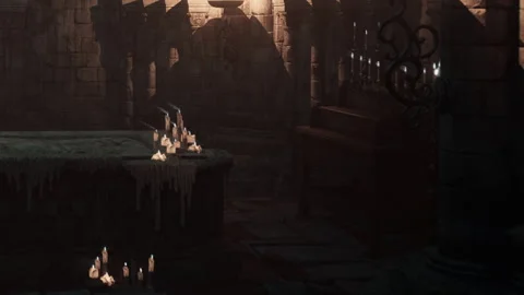 Visitors explore an ancient dark room filled with candles and stone walls Stock Footage 344057137
