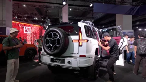 Visitors explore the Dongfeng M-Hero II at the KLIMS Vidéo 337354859