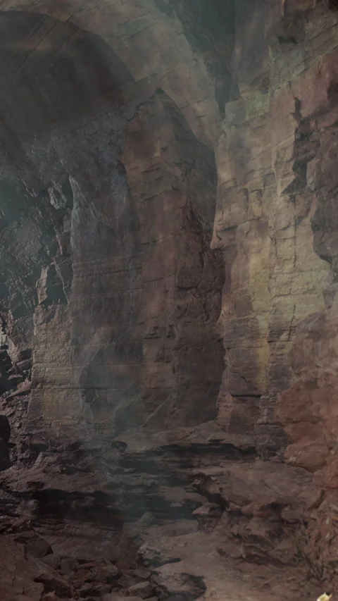 Visitors explore rocky cave at sunset near mountain area Stock Footage 339411307